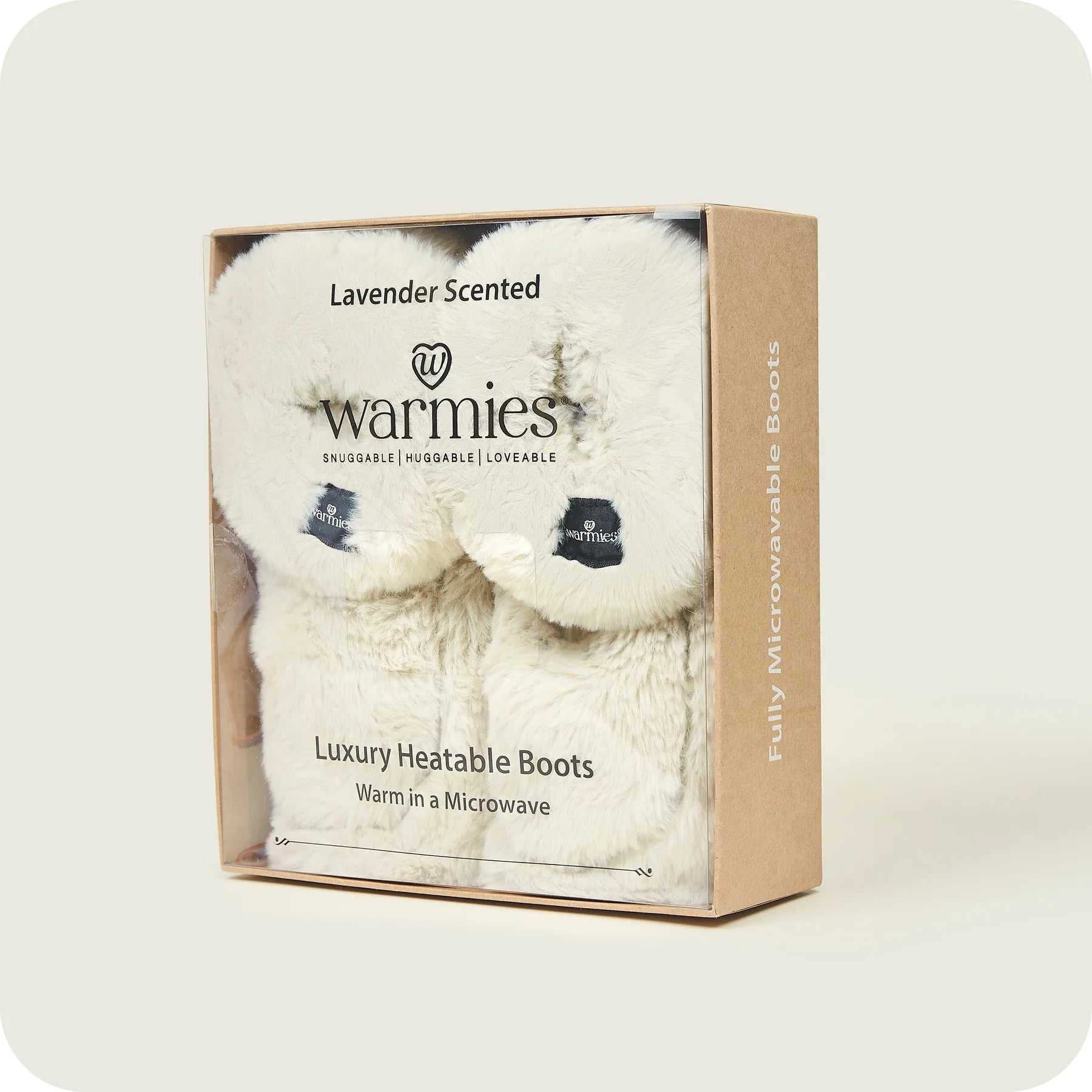 Warmies slippers in almond inside of packaging