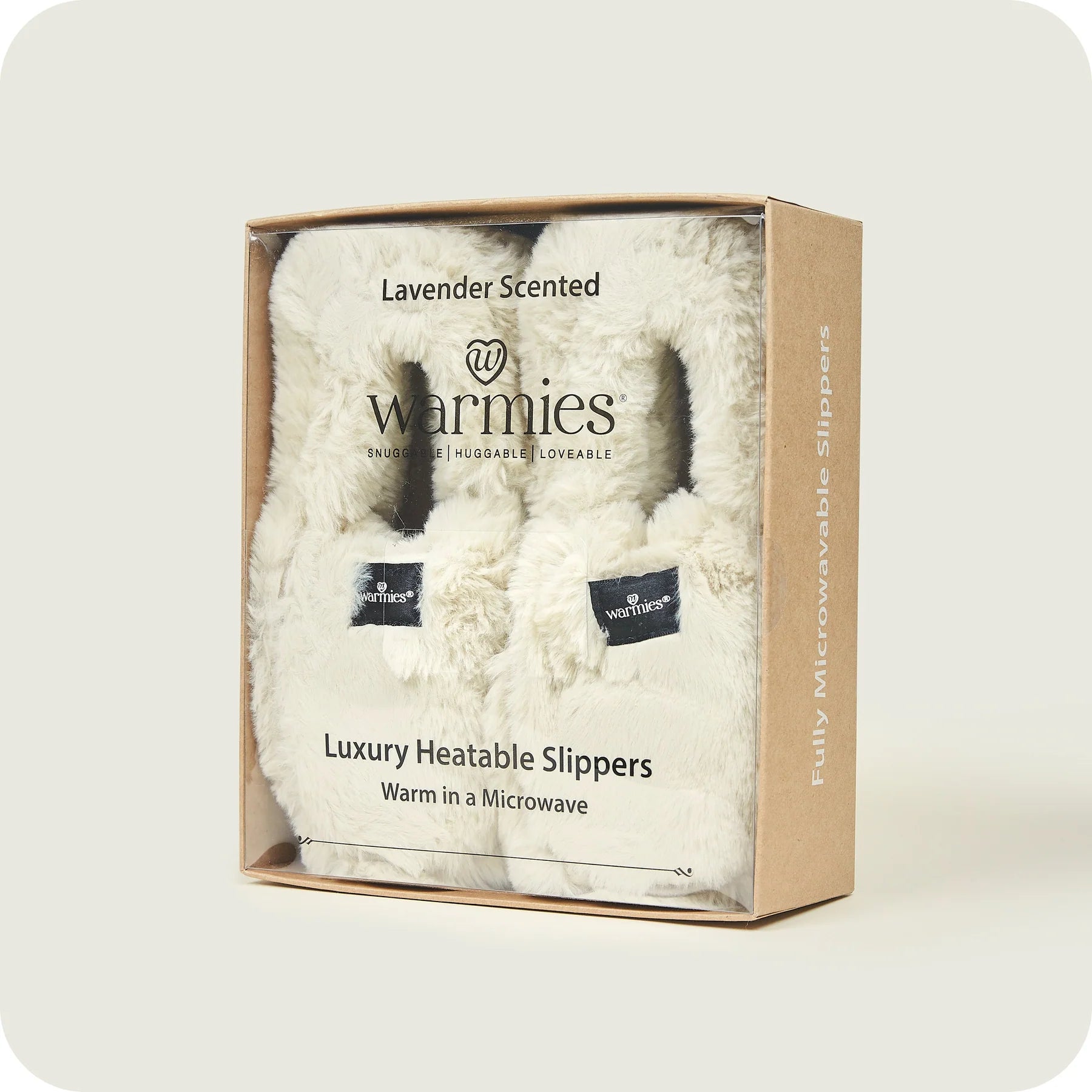 Warmies slippers in almond inside packaging